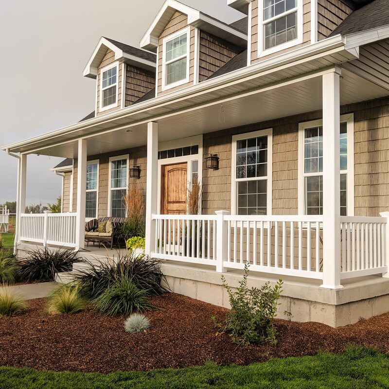 1) Unique, SEO-Effective Project Name
Traditional Shingle Home Front Porch with Low-Maintenance White Vinyl Railings

2) Description
Transform your traditional shingle home’s curb appeal with this classic custom front porch designed and installed by the specialists at DeckPro LLC. This expansive porch perfectly complements the home's multi-dormer traditional architecture. It features substantial white vinyl columns that support the large covered area, ensuring structural integrity with a clean aesthetic. We utilized a premium, low-maintenance white vinyl railing system with decorative balusters (pickets) and post caps to create a safe and stylish enclosure.