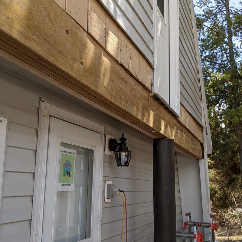 Extend your outdoor living possibilities with this custom deck by DeckPro LLC, which combines rustic elements with modern materials. We installed low-maintenance composite decking in a warm brown tone and paired it with a unique railing system that features natural wood posts and integrated wire mesh infill panels. For the ultimate in functional design, we included extensive built-in L-shaped bench seating, creating a cozy and inviting perimeter perfect for taking in scenic views.