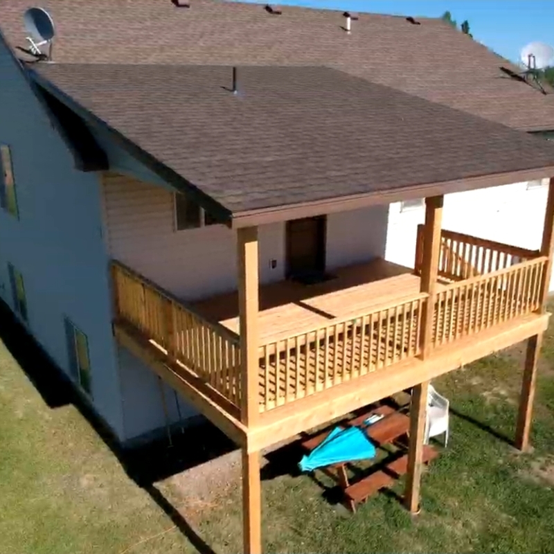 Extend your multi-directional natural views with this rustic custom composite deck by DeckPro LLC. Pictured on a beautiful partly cloudy day bordering natural vegetation and natural multi-directional natural views optimized spectacular multi-directional views optimized Optimized Optimized for expansive natural views optimized Optimized optimized.