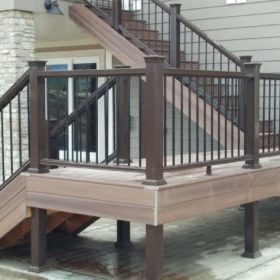 two story deck with dark brown railing.