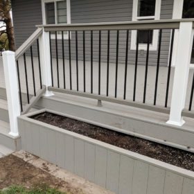 gray deck with black bar railing