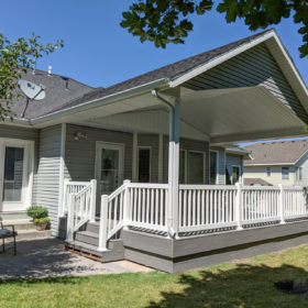 deck with room. Green grass.