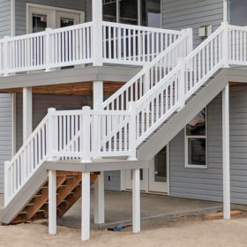 stairs with white railing.